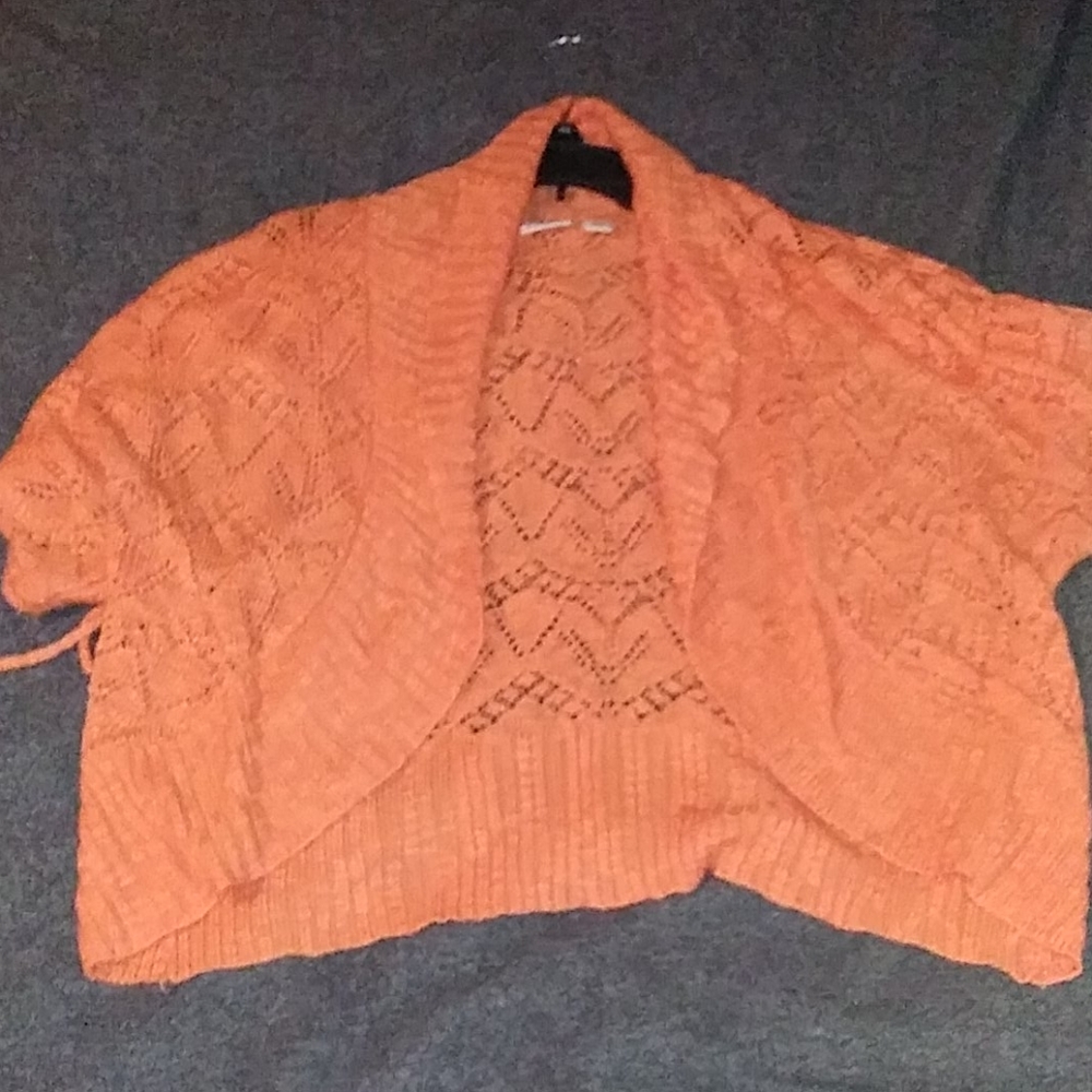Cute little orange knitted jacket